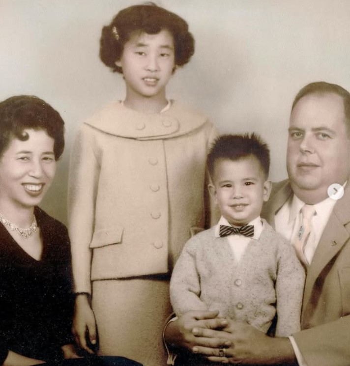 John Beam's childhood image with his parents and sister