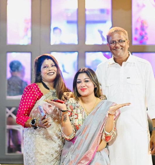 Nisha Chatterjee with her parents