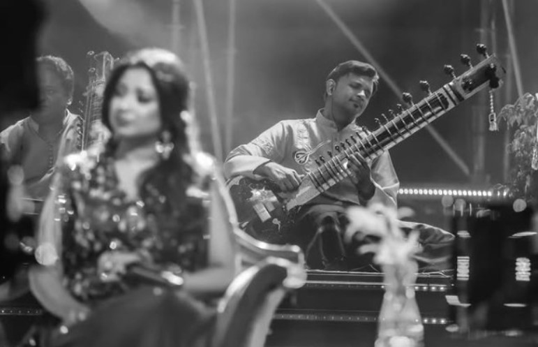 Bhagirath Bhatt playing guitar in an episode of the television singing reality show Indian Idol