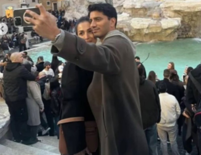Harsh Mehta while clicking a picture with Malaika Arora in Italy