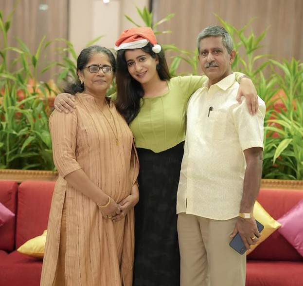 Megha Mathew with her parents