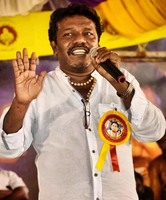Karunas while delivering a speech during a political rally