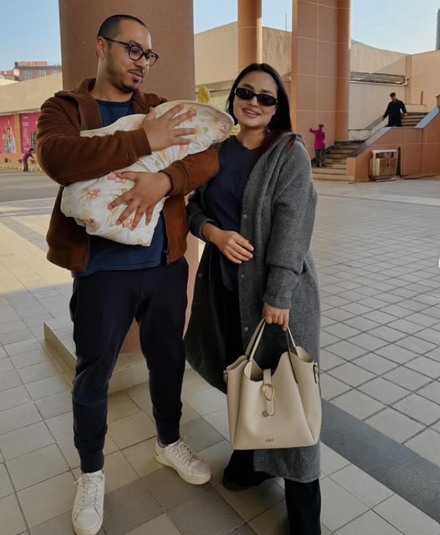 Sandhya Kc with her husband and daughter
