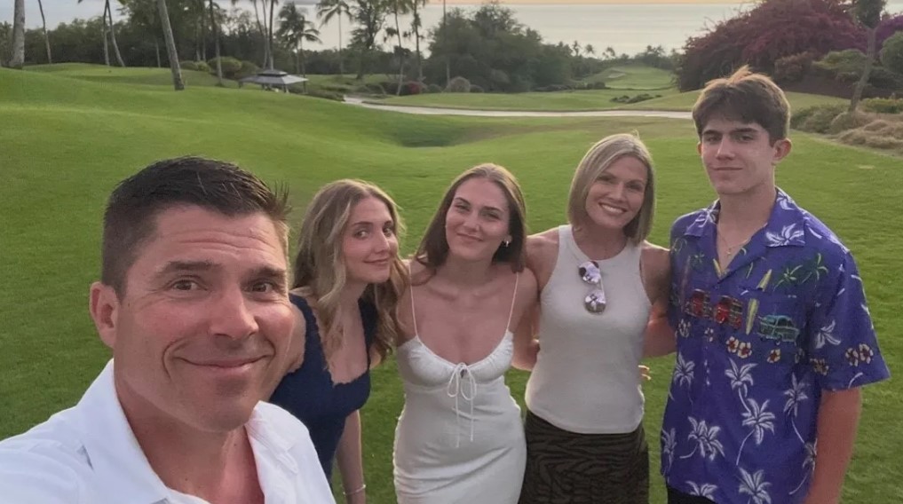 Marni Hughes with her husband and kids