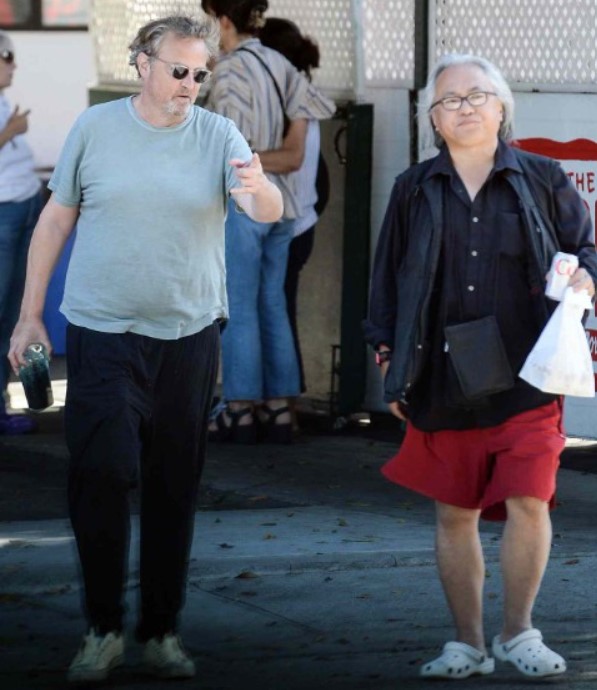 An old picture of Kenneth Iwamasa with Matthew Perry