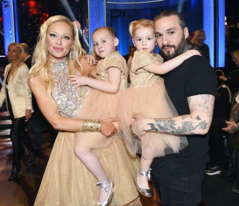 Isabel Adrian with her husband and daughters