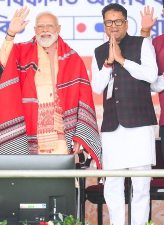 Manab Deka with Narendra Modi during election campaigns