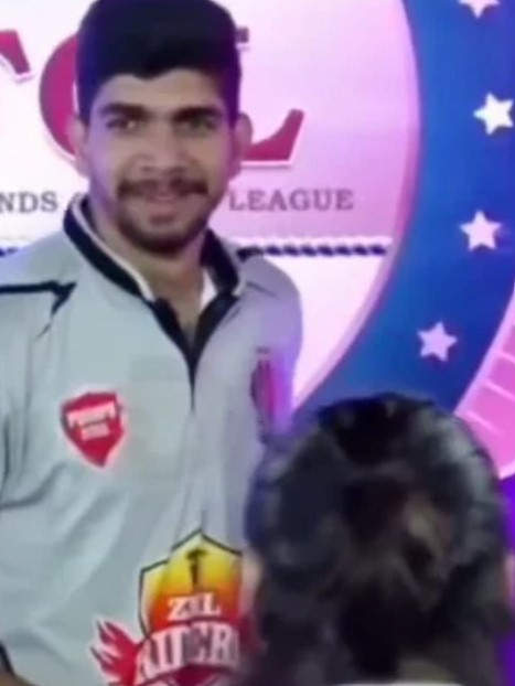 Chetan Chaudhary while receiving a prize after a cricket match