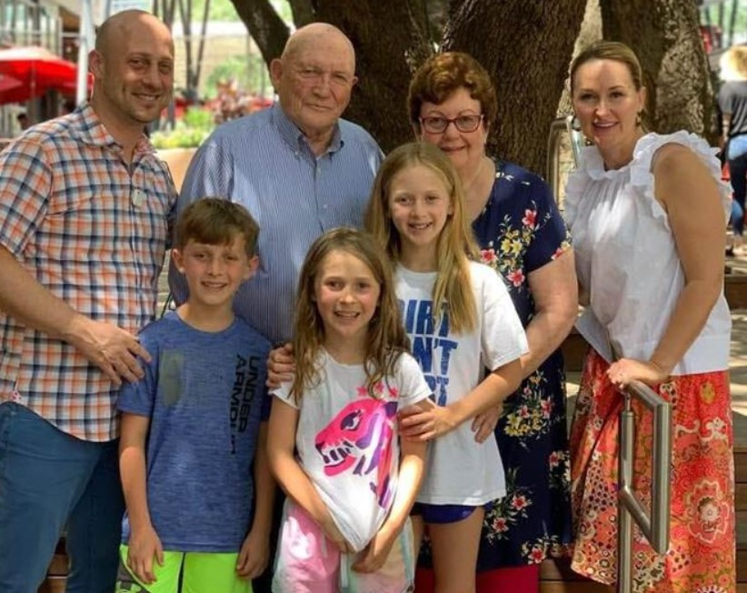 Joshua Baer with his wife, kids and parents