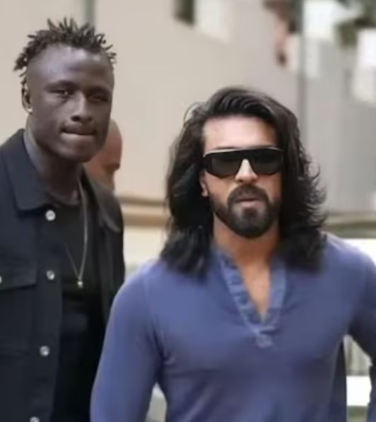 Kevin Kunta with actor Ram Charan