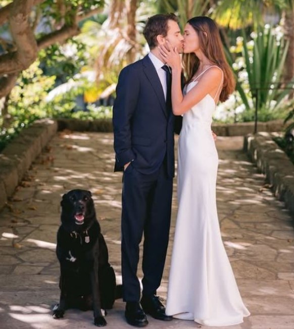 Natalie Kuckenburg and Paul Wesley on their wedding day with their pet dog