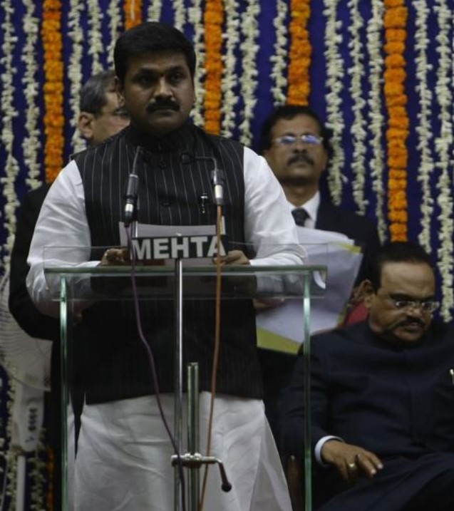Sachin Ahir while taking an oath as a minister