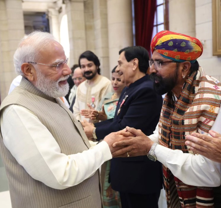 Taga Ram Bheel with Narendra Modi