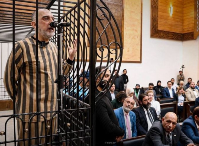 A photo of ongoing public trial of Atef Najib in Damascus