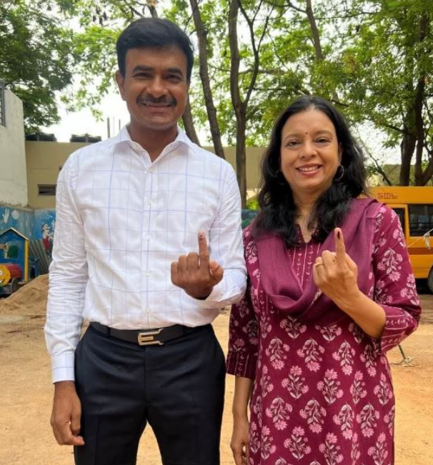 C. V. Anand with his wife