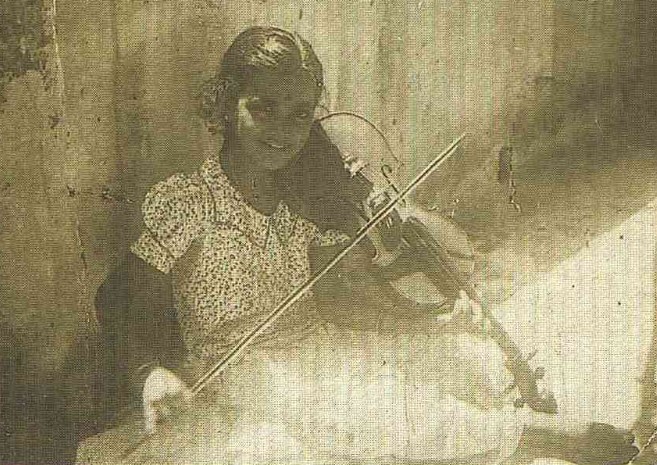 N. Rajam at the age of 6 while playing violin