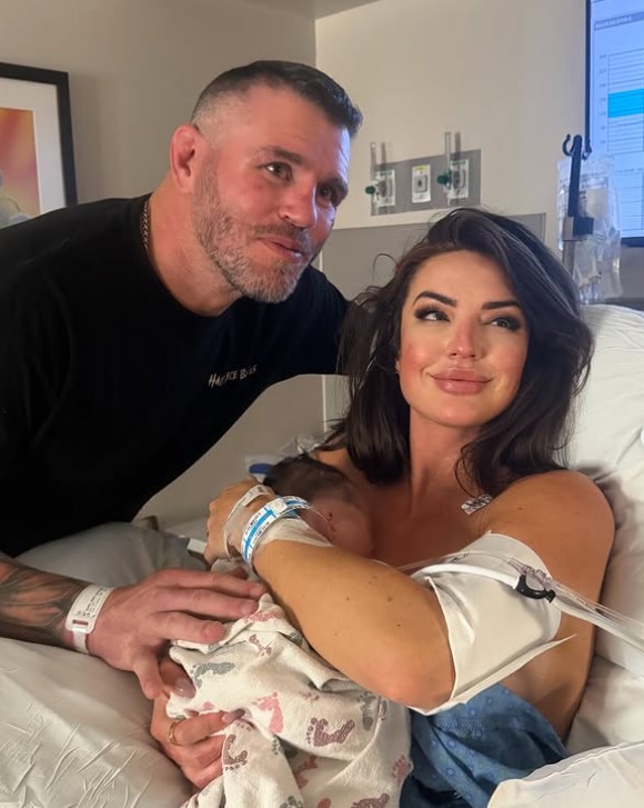 Whitney Johns with her husband and daughter